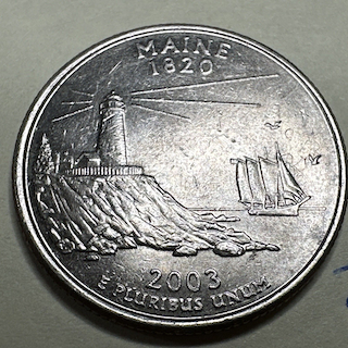 2003 Maine quarter 'In Cod We Trust' die-fill variety showing G reading as C in the motto