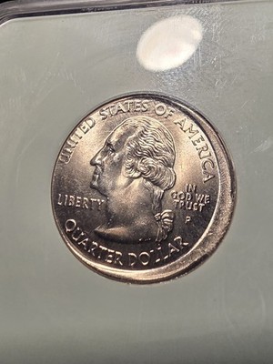 2003 quarter off-center strike error showing design shifted off-center with blank planchet crescent visible